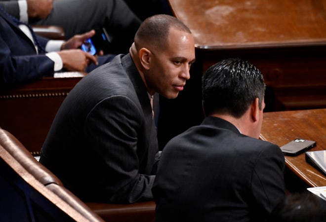 US Democratic Representative from New York Hakeem Jeffries, the Minority Leader-elect, speaks with a colleague as the House of Representatives continues voting for new speaker at the US Capitol in Washington, DC, January 4, 2023.