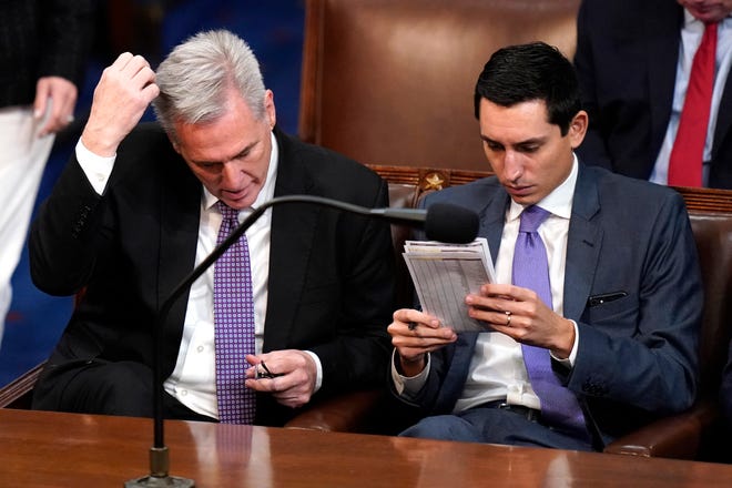 Rep. Kevin McCarthy, R-Calif., listens to votes being cast in the House chamber as the House meets for a second day to elect a speaker and convene the 118th Congress in Washington, Wednesday, Jan. 4, 2023.