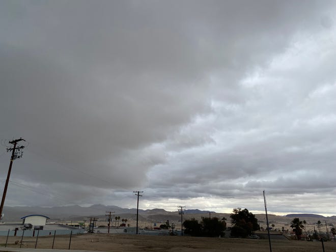 A cloudy but dry day quickly shifted to a rare state of steady rain in the High Desert as an atmospheric river pounded in from the Los Angeles area.
