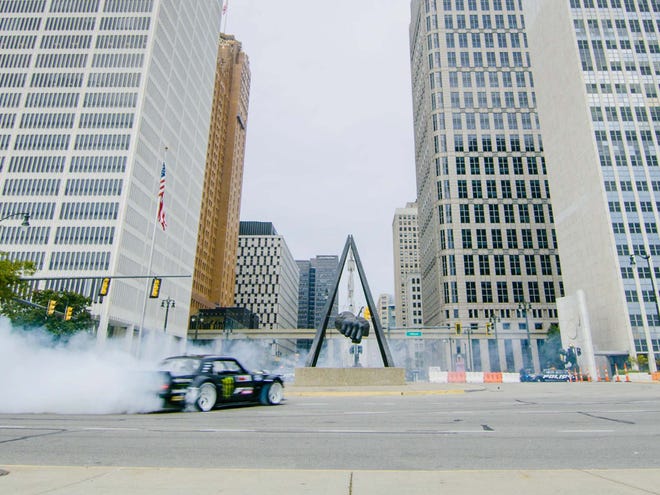 Ken Block does donuts around the Fist on Jefferson Avenue for Gymkhana 10.
