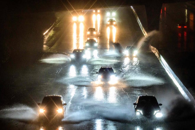 January 4, 2022: Drivers barrel into standing water on Interstate 101 in San Francisco, California, on Jan. 4, 2023. - A bomb cyclone smashed into California on Jan. 4, 2023, bringing powerful winds and torrential rain expected to cause flooding in areas already saturated by consecutive storms.