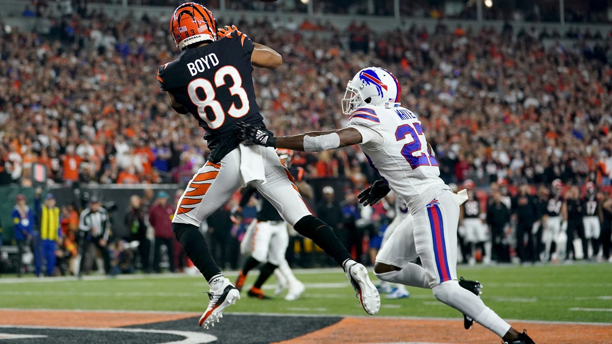 Bengals wide receiver Tyler Boyd catches a touchdown pass in front of Bills cornerback Tre'Davious White during the first quarter of their game on Jan. 2.