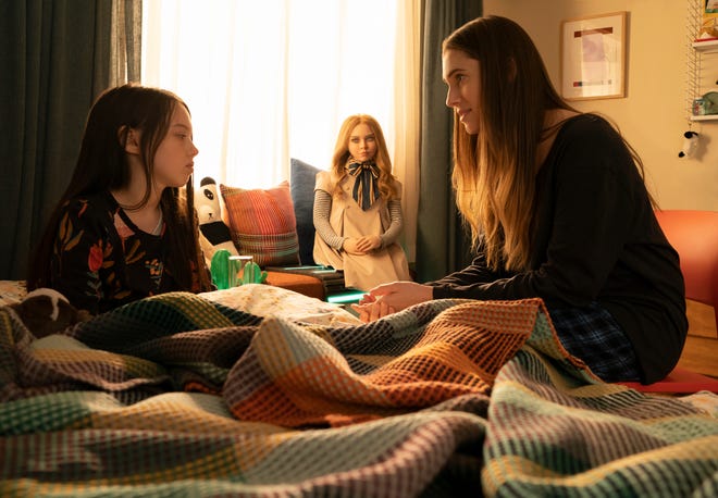 After a tragedy, Cady (Violet McGraw, left) moves in with her aunt Gemma (Allison Williams) and gets an artificially intelligent new friend in the satirical horror film "M3GAN."