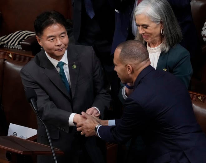 Ted Lieu, D-Calif. shakes hands with Hakeem Jeffries, D-Calif., after nominating Jeffries for House speaker.