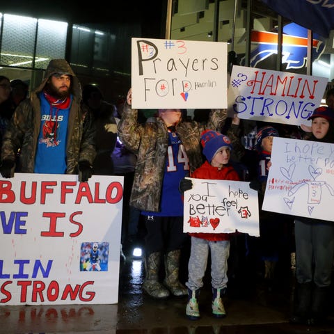 Buffalo Bills fans attend a candlelight prayer vig