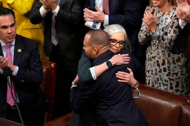 Rep. Katherine Clark, D-Mass., hugs Rep. Hakeem Jeffries, D-N.Y., after nominating him for Speaker of the House before the eighth round of voting in the House chamber.