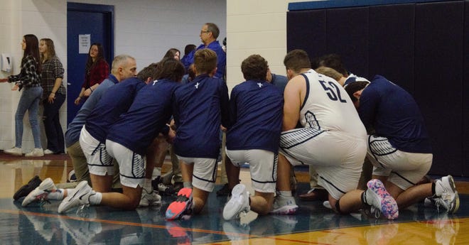 The Gaylord St. Mary's team prays prior to a boys basketball matchup between Gaylord St. Mary's and Mancelona on Thursday, January 5 at Monsignor Kaminski Gymnasium in Gaylord, Mich.