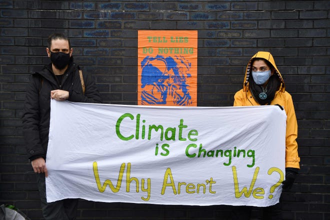 Climate activists participate in a protest action in Glasgow in November 2021 during the COP26 UN Climate Change Conference.