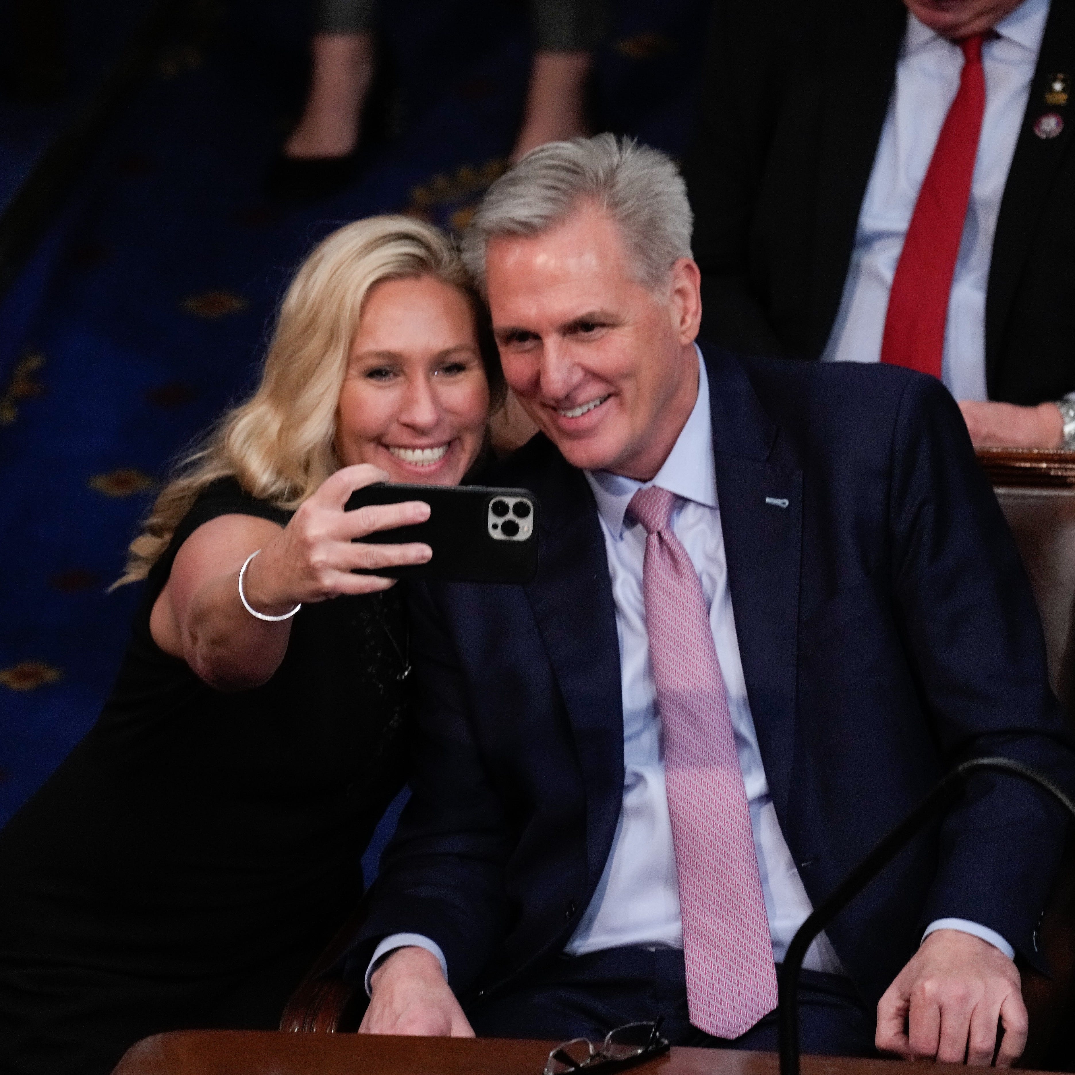 Rep. Marjorie Taylor Greene, R-Ga., takes a selfie with the newly elected House Speaker Kevin McCarthy on Jan. 6, 2023.