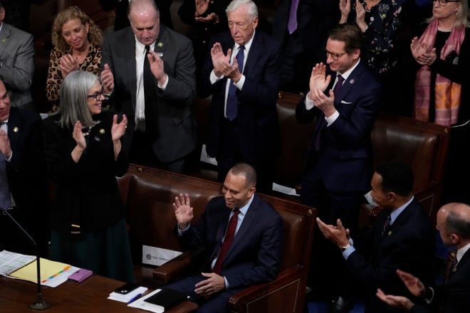 Rep. Hakeem Jeffries receives an ovation from fellow Democrats after being nominated for speaker