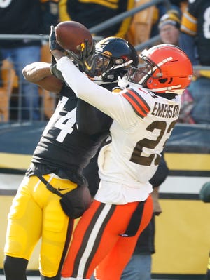 Jan 8, 2023; Pittsburgh, Pennsylvania, USA;  Cleveland Browns cornerback Martin Emerson Jr. (23) defends a pass intended for Pittsburgh Steelers wide receiver George Pickens (14) during the first quarter at Acrisure Stadium. Mandatory Credit: Charles LeClaire-USA TODAY Sports