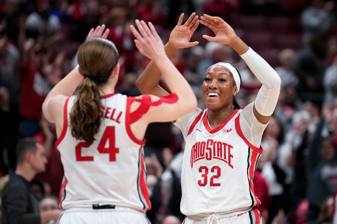 Jan 8, 2023; Columbus, Ohio, USA;  Ohio State Buckeyes forward Cotie McMahon (32) high-fives guard Taylor Mikesell (24) during the fourth quarter of the women’s NCAA division I basketball game between the Ohio State Buckeyes and the Illinois Fighting Illini at Value City Arena on Sunday afternoon.