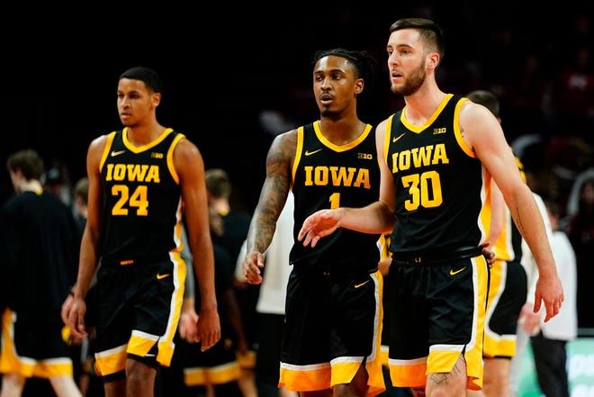 Iowa's Connor McCaffery (30), Ahron Ulis (1) and Kris Murray (24) during the first half of an NCAA basketball game against Rutgers, Sunday, Jan. 8, 2023, at Jersey Mike's Arena in Piscataway, N.J.