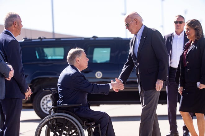 President Joe Biden exchanges handshakes with Texas Gov. Greg Abbott upon his arrival in El Paso, Texas, to assess border enforcement operations. Abbott dismissed the president's visit to the U.S.-Mexico border as a series of carefully staged photo ops.