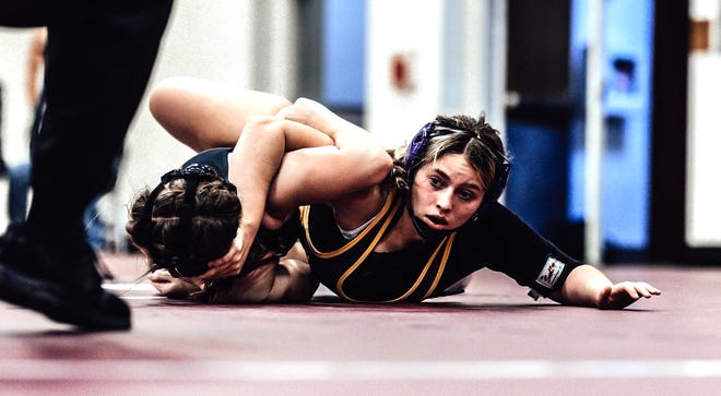 Bronson's MacKenna Webster, shown here working towards a pin in early season action, took home the gold medal Saturday from the Adam H Provencal Invite