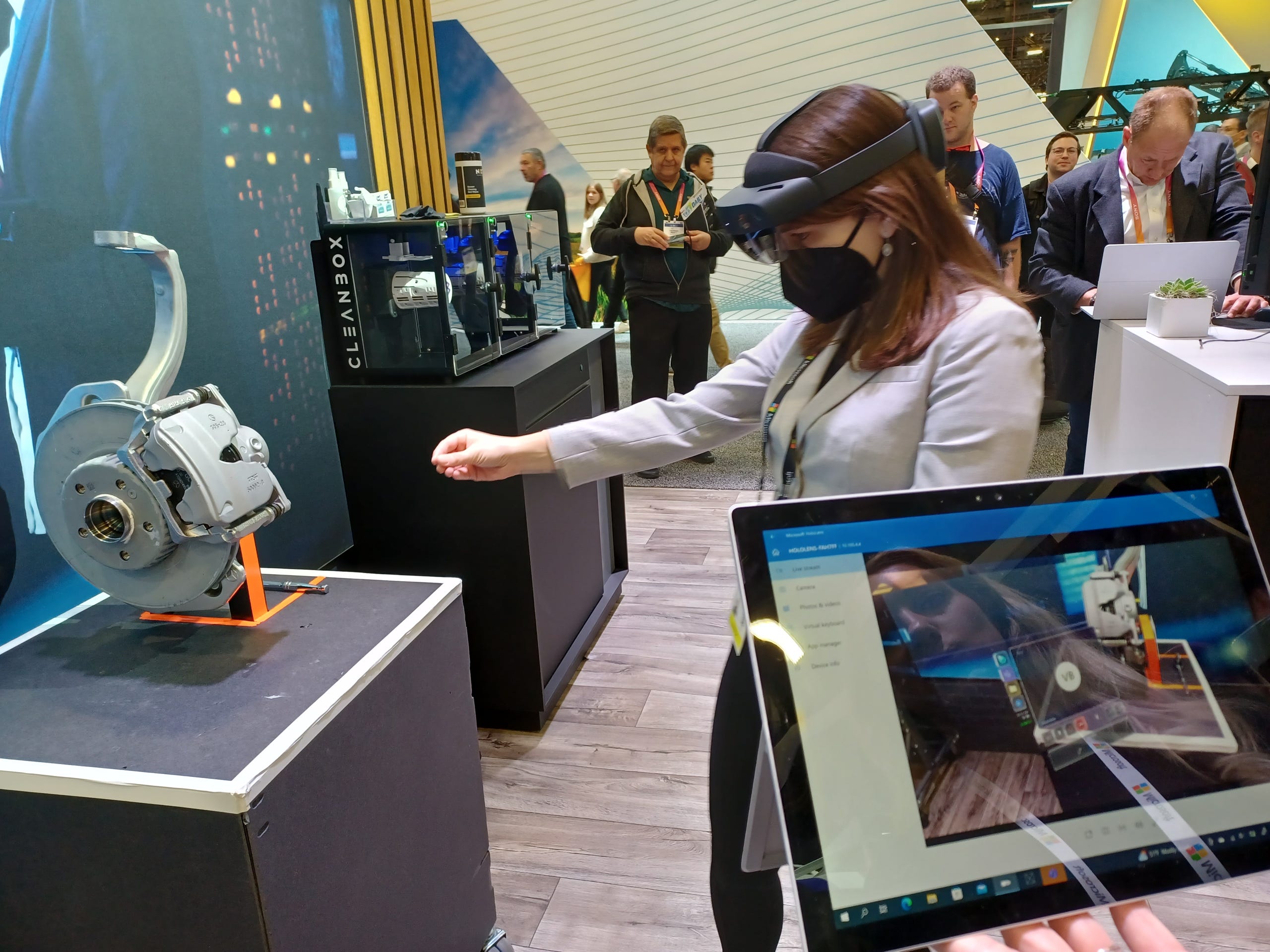 Juliette Weiss, design guide for Microsoft Dynamics 365, demonstrates the company's mixed reality technology using the HoloLens that allows vehicle technicians to connect remotely with engineers.