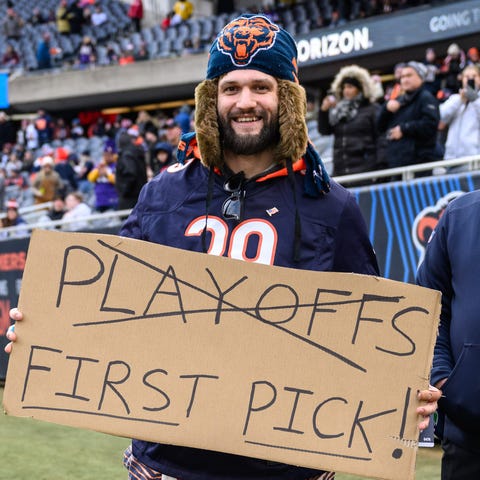 A Chicago Bears fan holds a sign before the Week 1