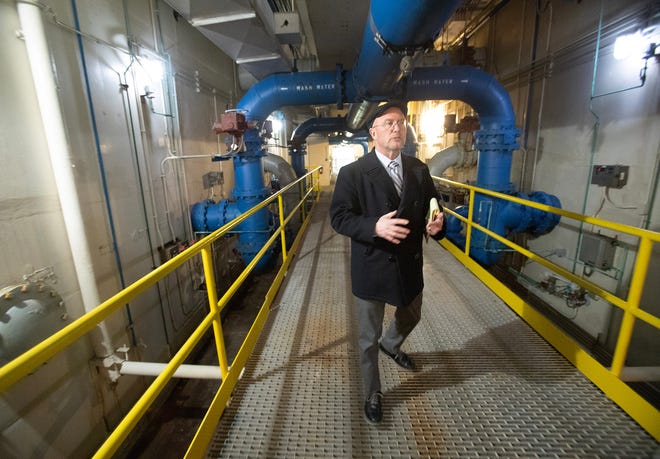 Tyler Converse, superintendent of the Canton Water Department, explains the filtration process at the Sugar Creek Water Treatment Plant in Sugarcreek Township in Tuscarawas County.