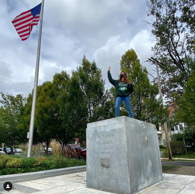 Aubrey Plaza stands where a Christopher Columbus statue once stood in a photograph she posted to Instagram in 2021. The spot has been unofficially renamed The Aubrey Plaza Plaza and has fans worldwide through a cheeky Facebook page run by Wilmington's Pete Romano.