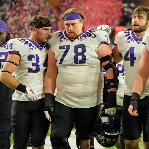 TCU players walk off the field after losing to Geo