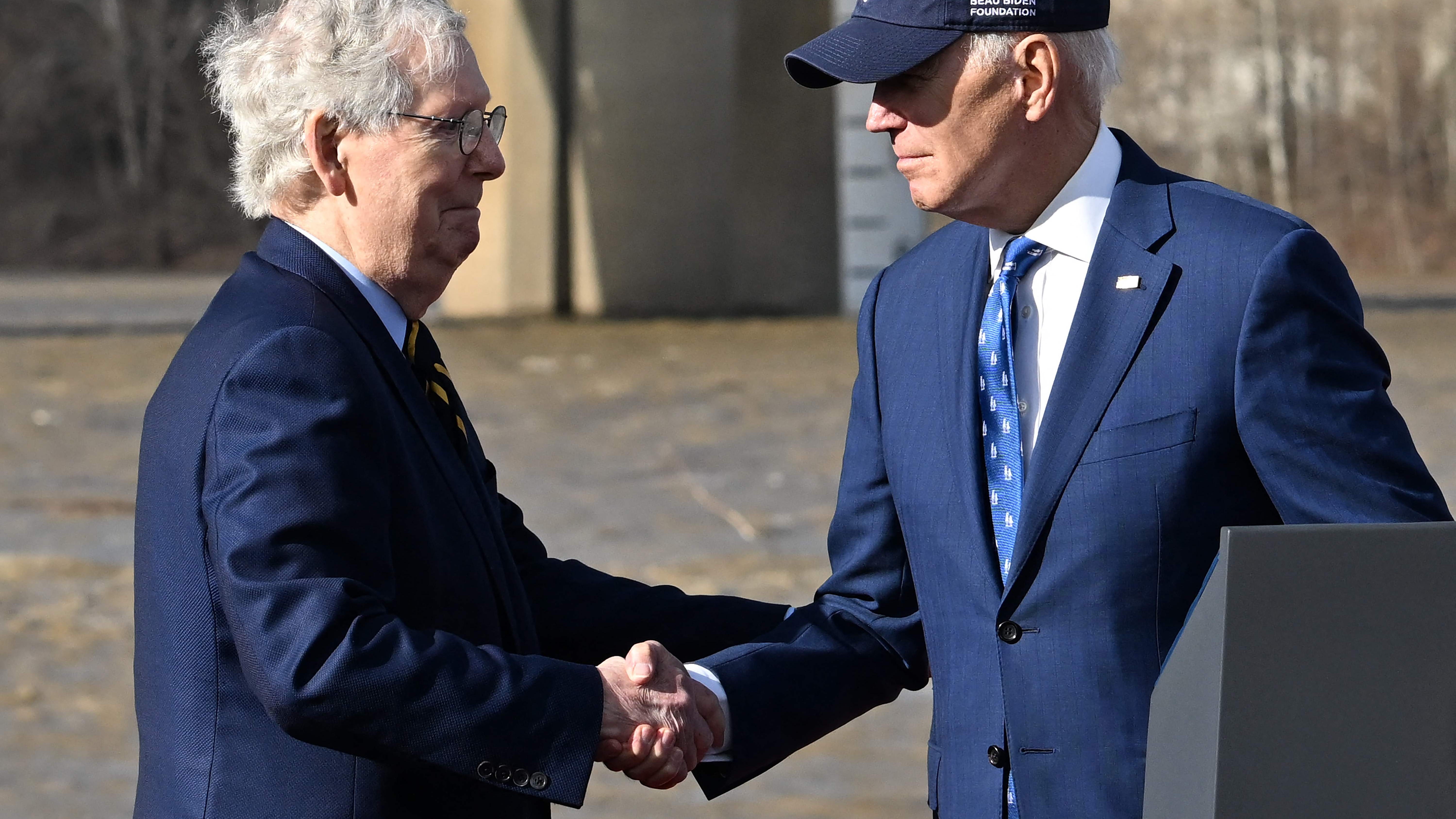 President Joe Biden, right, greets Senate Republican leader Mitch McConnell at a bridge in Covington, Kentucky, on Jan. 4, 2023.