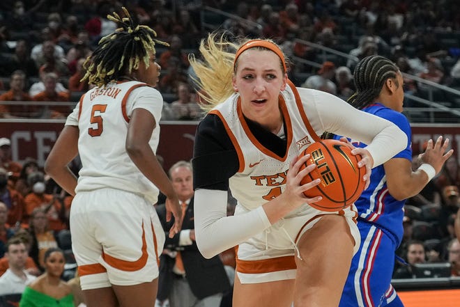 Texas Longhorns forward Taylor Jones, 44, retrieves the ball during the Longhorns' game against the University of Kansas at the Moody Center on Tuesday, January 10, 2023. 