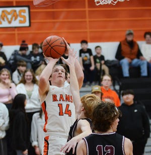 Harbor Springs senior Jack Clancy pulls up for a second half jumper with a hand in his face against visiting Charlevoix on Tuesday.
