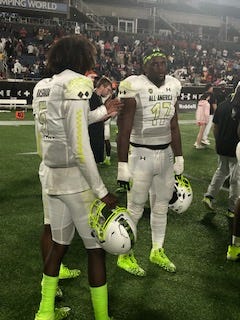 Incoming Florida DL Kelby Collins (17) with QB Jaden Rashada following last week's Under Armour All-American game