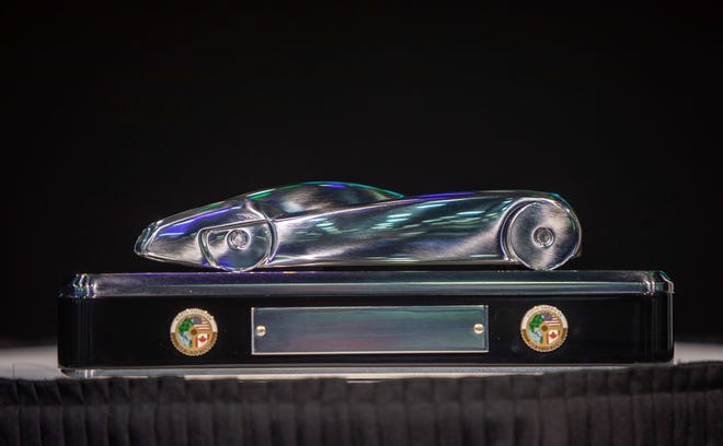 The award for the 2023 North American Car, Truck and Utility Vehicle of the Year Awards sits on the AMD stage during the 2022 North American International Auto Show at Huntington Place convention center in Detroit on Wednesday, Sept. 14, 2022.