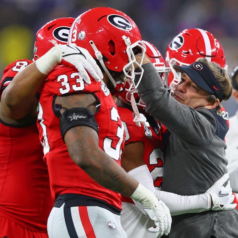 Kirby Smart embraces his players during the fourth