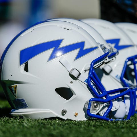 Air Force Falcons helmets on the sideline.
