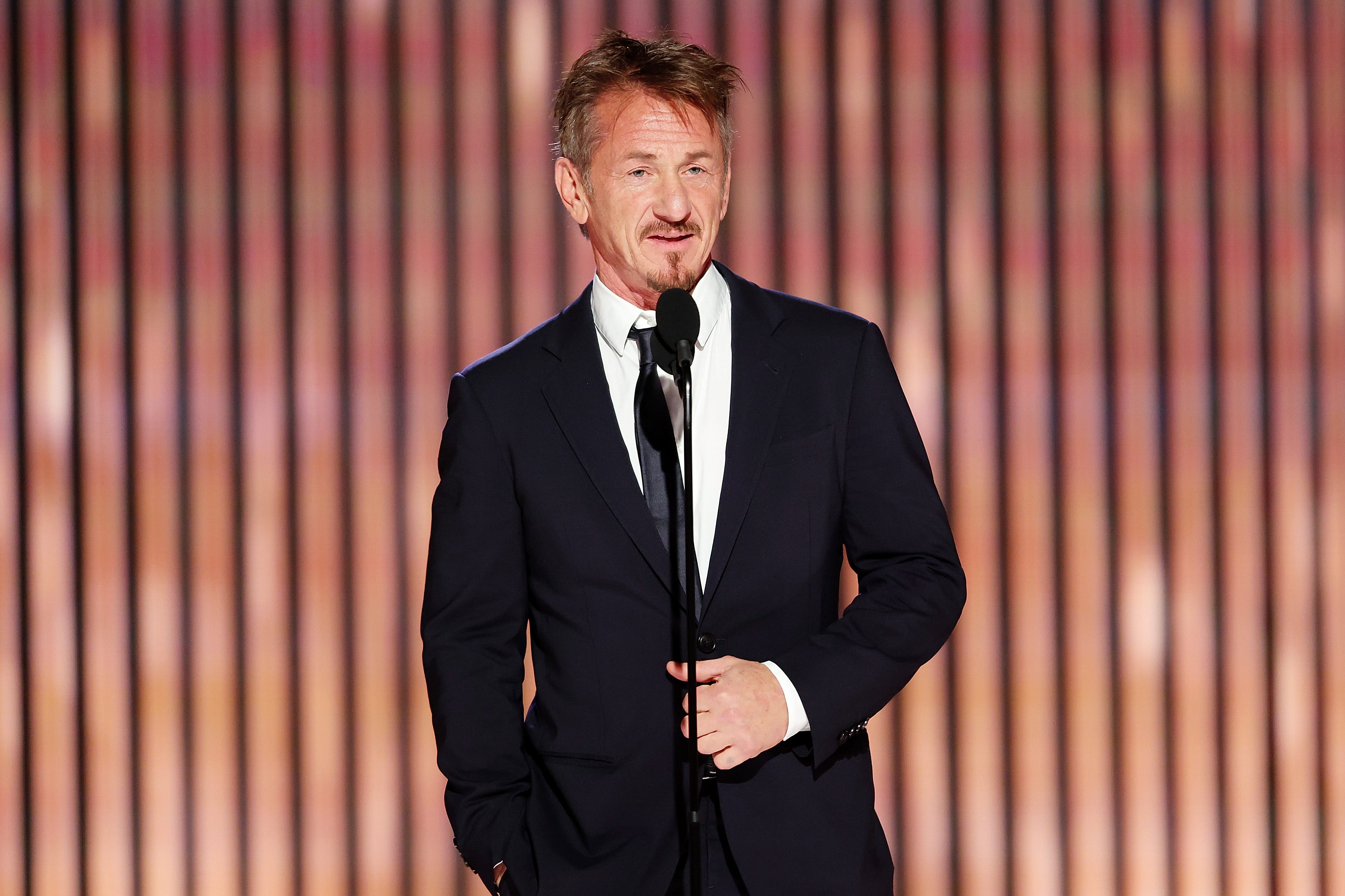 Sean Penn speaks onstage.