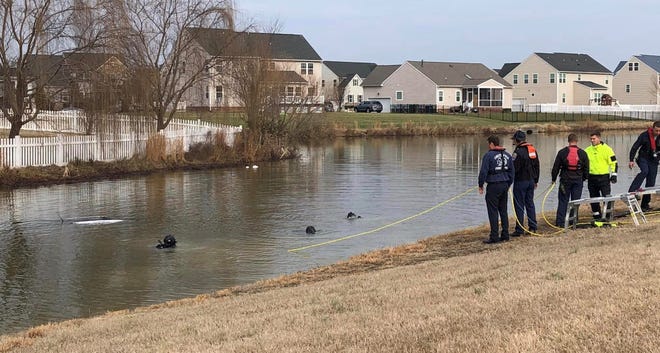 Chesterfield County Scuba Rescue dive to search for occupants in a vehicle that drove into the retention pond at the Mount Blanco at Meadowville Landing neighborhood in Chester on Thursday, January 12.