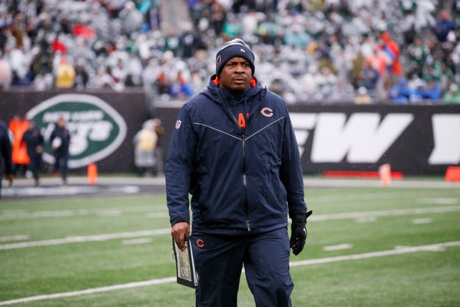 Former Guilford star Carlos Polk helps lead the Chicago Bears onto the field to take on the New York Jets, Sunday, Nov. 27, 2022, in East Rutherford, New Jersey. Polk was the assistant special teams coach for the Bears this season.