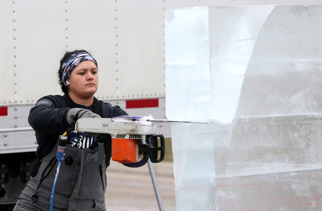 Sammy Moore of Elkhart carves a sailboat from a block of ice Thursday, Jan. 12, 2023, in preparation for the Hunter Ice Festival that runs Friday through Sunday in downtown Niles and Riverfront Park.