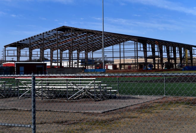 The steel skeleton of Th Den at Cooper High School, as seen from the ballfields Wednesday..