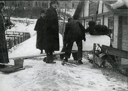 This 1917-18 photograph shows several Montreat residents cutting blocks of ice.
