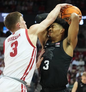 Wisconsin freshman guard Connor Essegian, guarding Michigan State's Jaden Akins on Tuesday night, has been getting a crash course in the physical nature of Big Ten play.