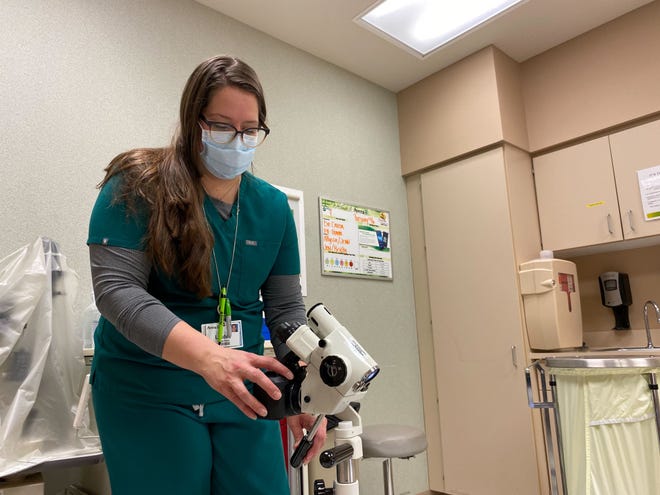 Lindee Miller, a nurse at Avera St. Mary’s Hospital in Pierre, South Dakota, turns on the camera attached to a colposcope, a magnifying device used to closely examine the vagina and cervix. The camera transmits a live view of the exam to the remote sexual assault nurse examiner. (Arielle Zionts/KHN)