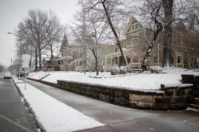 Snow falls upon the houses, trees and streets along Historic Walnut Street on Thursday, Jan. 12, 2023.