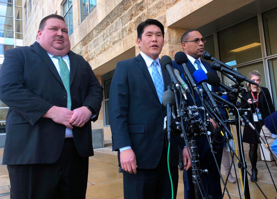 U.S. Attorney Robert Hur, center, of the District of Maryland, speaks during a news conference about Coast Guard Lt. Christopher Paul Hasson, Thursday, Feb. 21, 2019, outside the federal courthouse in Greenbelt, Md.