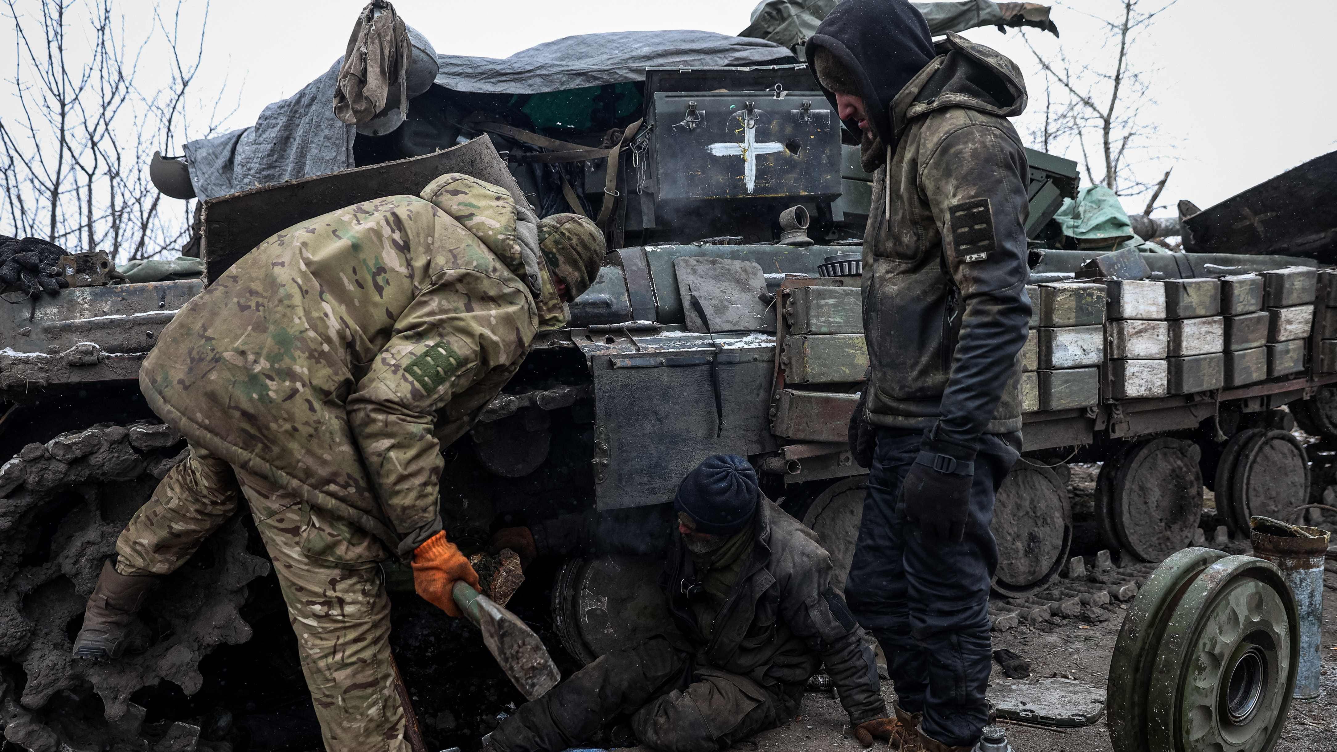 Ukrainian servicemen repair a tank near Kreminna, Lugansk region, on Jan. 12, 2023.
