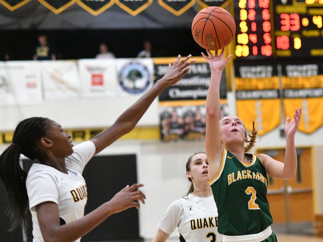 Blackhawk's Kassie Potts shoots as Quaker Valley's Mimi Thiero defends during Thursday night's game at Quaker Valley.