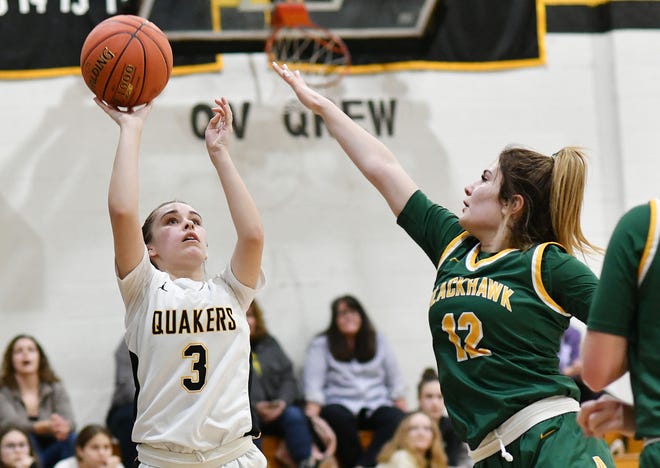 Quaker Valley's Madison Chapman shoots as Blackhawk's Ava Davis defends during Thursday night's game at Quaker Valley.