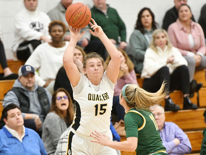 Quaker Valley's Shannon Von Kaenel shoots over Blackhawk's Alena Fusetti during Thursday nightÕs game at Quaker Valley.