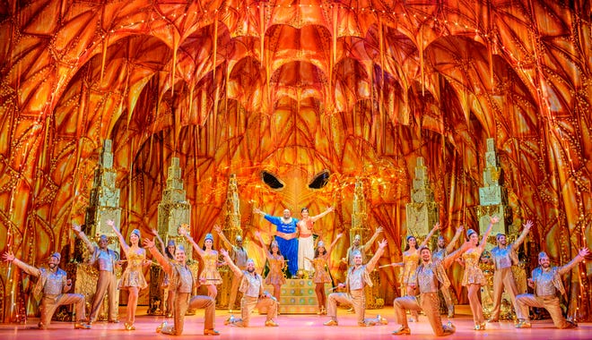 The cast of Disney Theatrical Productions’ “Aladdin,” with Marcus M. Martin as Genie and Adi Roy as Aladdin.