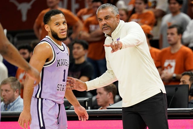 Kansas State coach Jerome Tang, right, talks to point guard Markquis Nowell (1) during the Wildcats' Jan. 3 game against Texas at the Moody Center in Austin.
