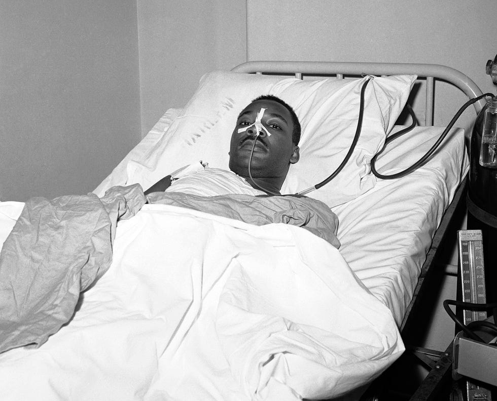 FILE - In this Sept. 21, 1958 file photo, Martin Luther King Jr. recovers from surgery in bed at New York's Harlem Hospital on following an operation to remove steel letter opener from his chest after being stabbed by a mentally disturbed woman as he signed books in Harlem. The New York City surgeon, Dr. John W.V. Cordice, who was part of the medical team that saved King the nearly fatal stab wound has died at the age of 95. The death was announced Tuesday, Dec. 31, 2013, by the city agency that oversees Harlem Hospital Center, where Cordice was formerly an attending surgeon and chief of thoracic surgery.