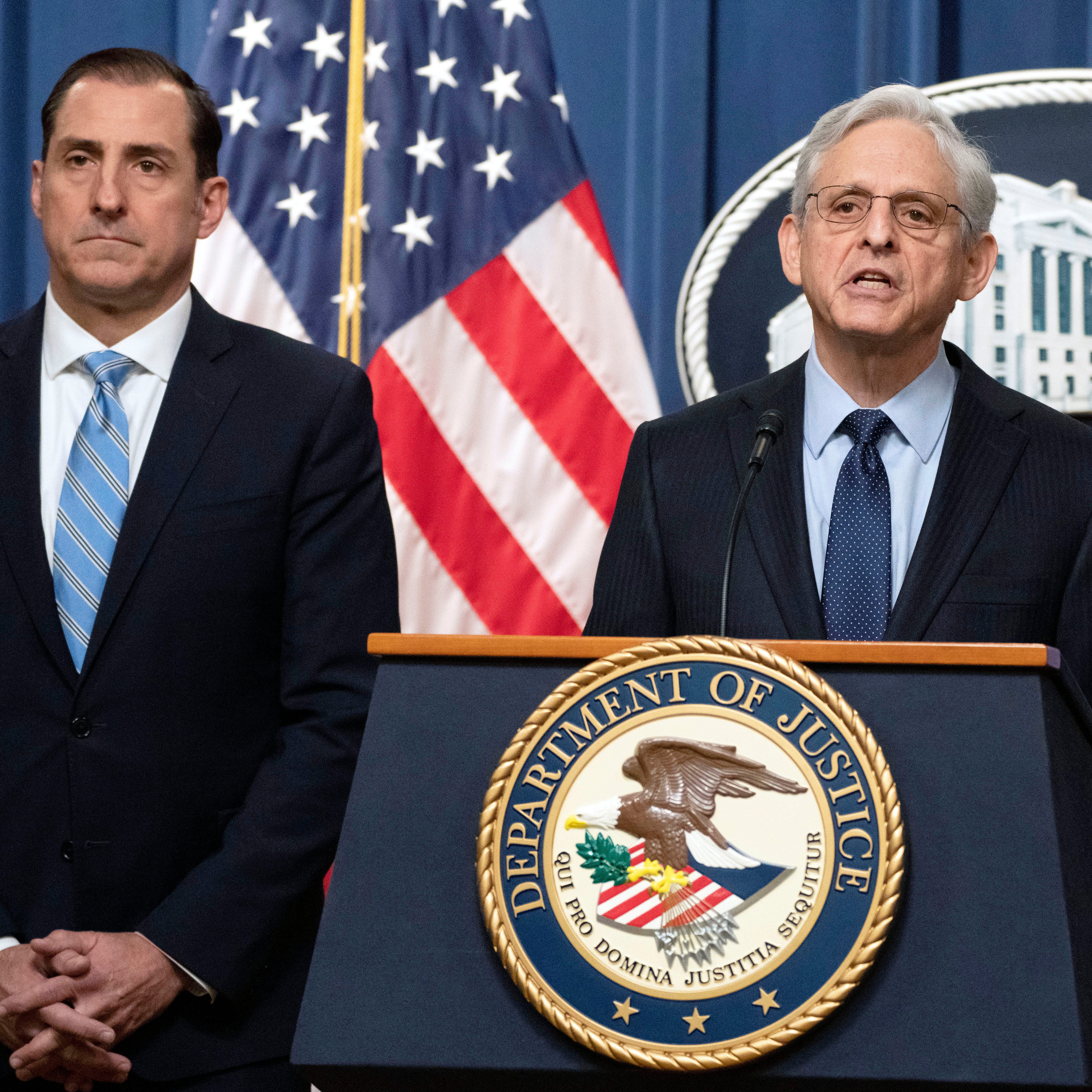 Attorney General Merrick Garland speaks during a news conference at the Department of Justice, Thursday, Jan. 12, 2023, in Washington, as John Lausch, the U.S. Attorney in Chicago, looks on.