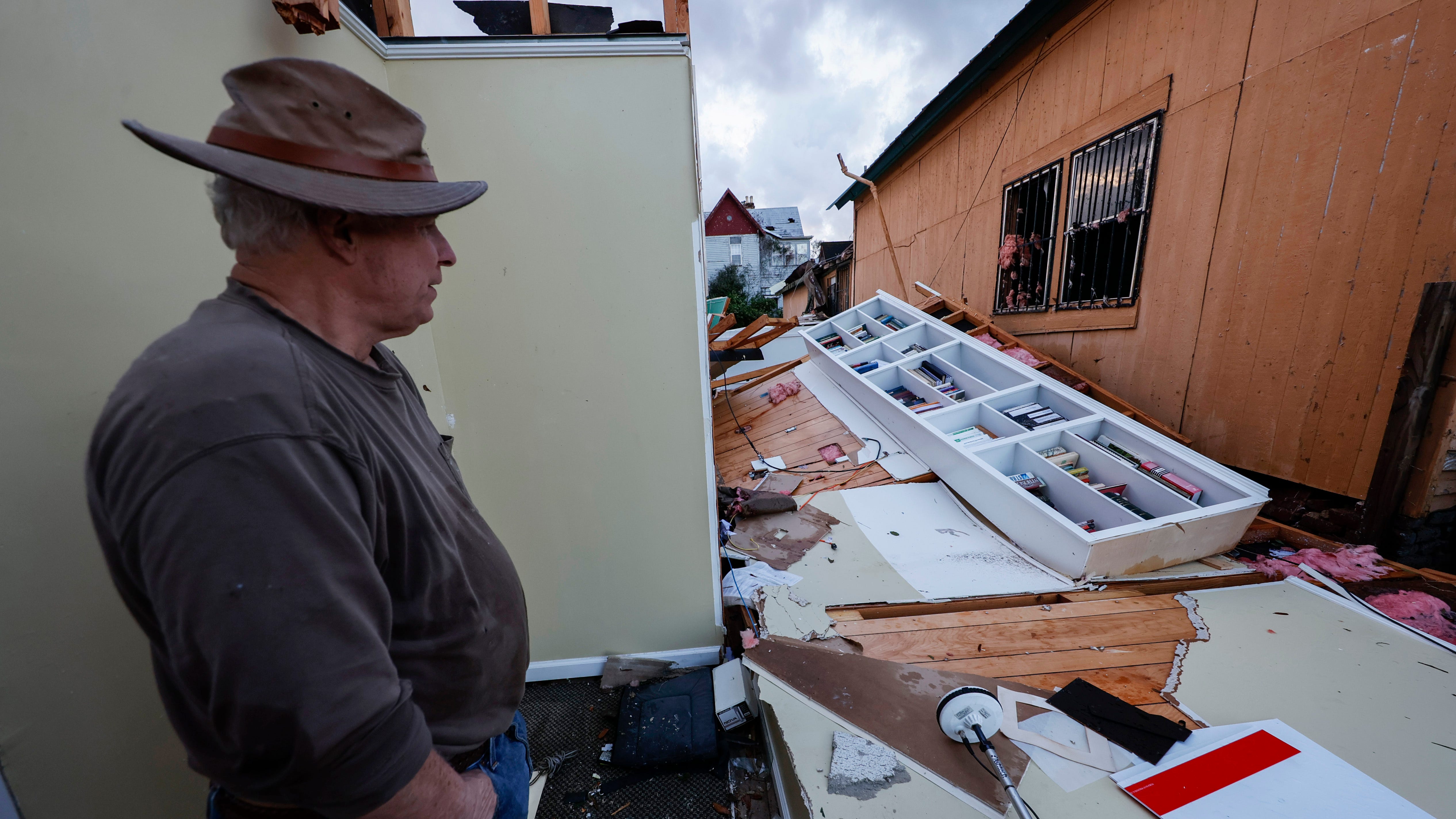 Mel Gilmer surveys the damage to his business after a tornado passed through downtown Selma, Ala., Thursday, Jan. 12, 2023.
